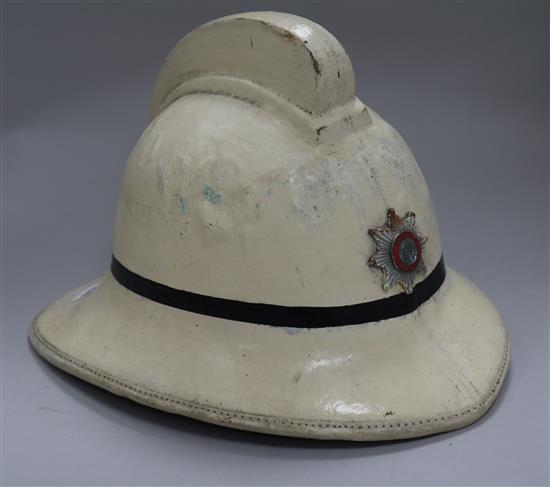 A Brighton Fire Brigade helmet, mixed badges and buttons etc